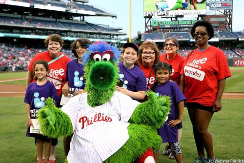 Summer Reading stars and their nominating neighborhood librarians pose with the Phillie Phanatic at Citizens Bank Park.